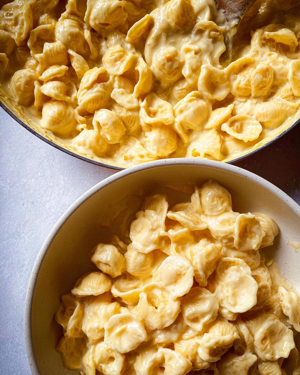 Close-up of creamy macaroni and cheese, a perfect easy dinner recipe, served in a bowl and pot.
