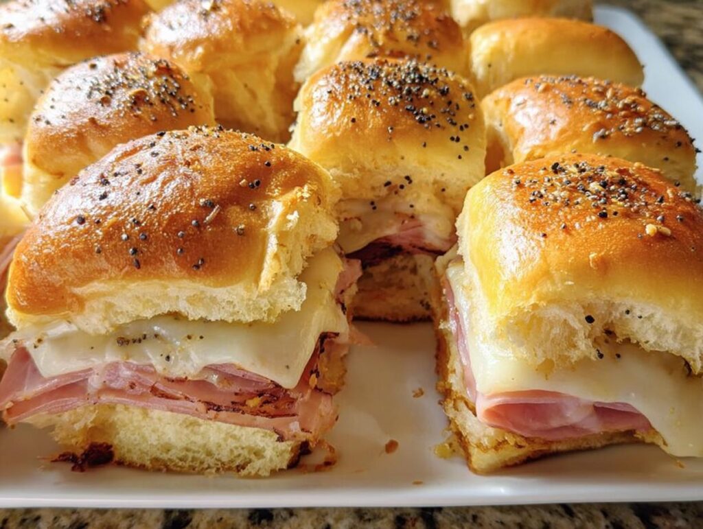 Close-up of delicious ham and cheese sliders, a perfect example from our 12 Genius Sandwich Ideas for Busy Weeknights.