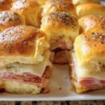 Close-up of delicious ham and cheese sliders, a perfect example from our 12 Genius Sandwich Ideas for Busy Weeknights.