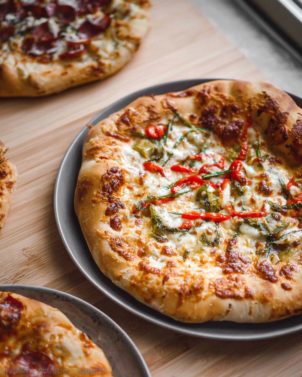 A close-up of a homemade pizza with melted cheese and red pepper toppings, part of a Pizza Night Recipes Guide.