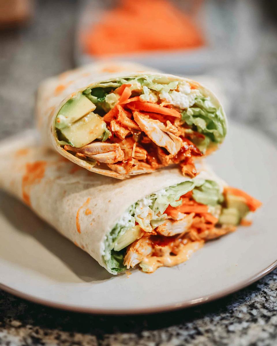 A delicious wrap filled with creamy spinach and eggs, chicken, avocado, and shredded carrots.