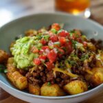A delicious Schnelle Kartoffel Taco Bowl Meal Prep with seasoned ground beef, crispy potatoes, guacamole, and pico de gallo.