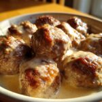 Close-up of a bowl of delicious Swedish meatballs in a creamy sauce, perfect for cozy ground beef recipes.