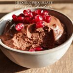 A bowl of rich, creamy High Protein Chocolate Pudding topped with fresh pomegranate seeds.